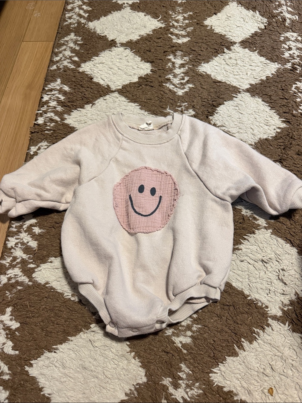 bebe Holic Beige Knit Baby onesie with smiley face Detail
